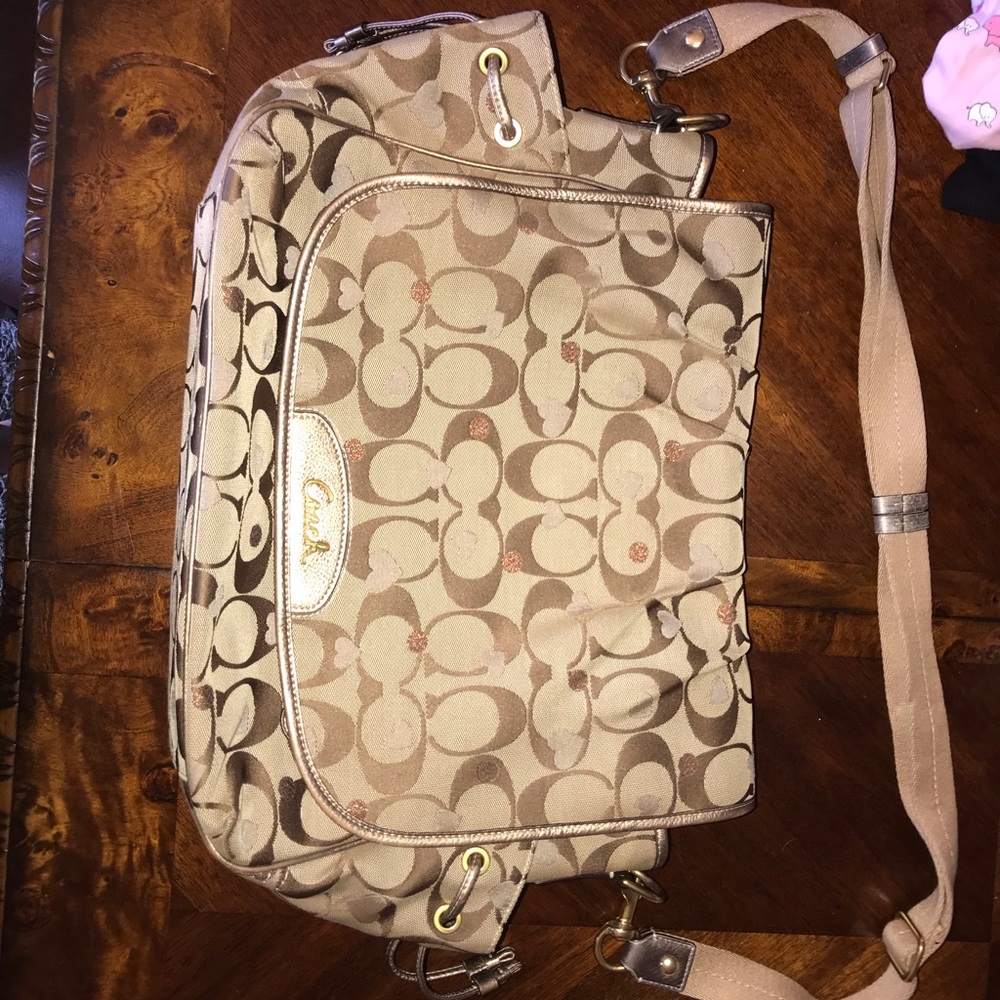 Coach diaper bag with changing pad